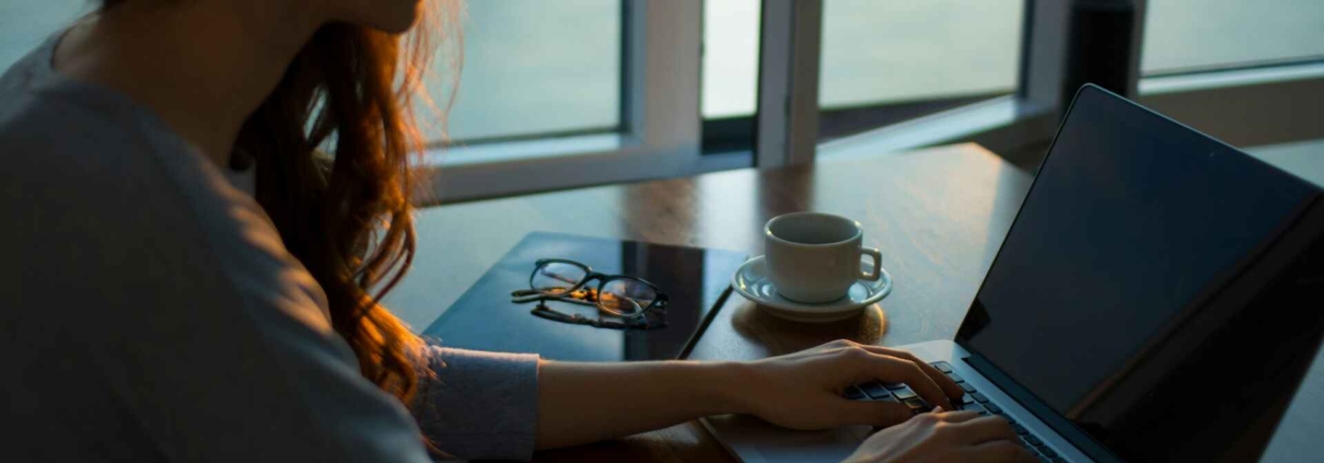 Woman browsing on her laptop