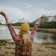 Woman with her arms outstretched outdoors